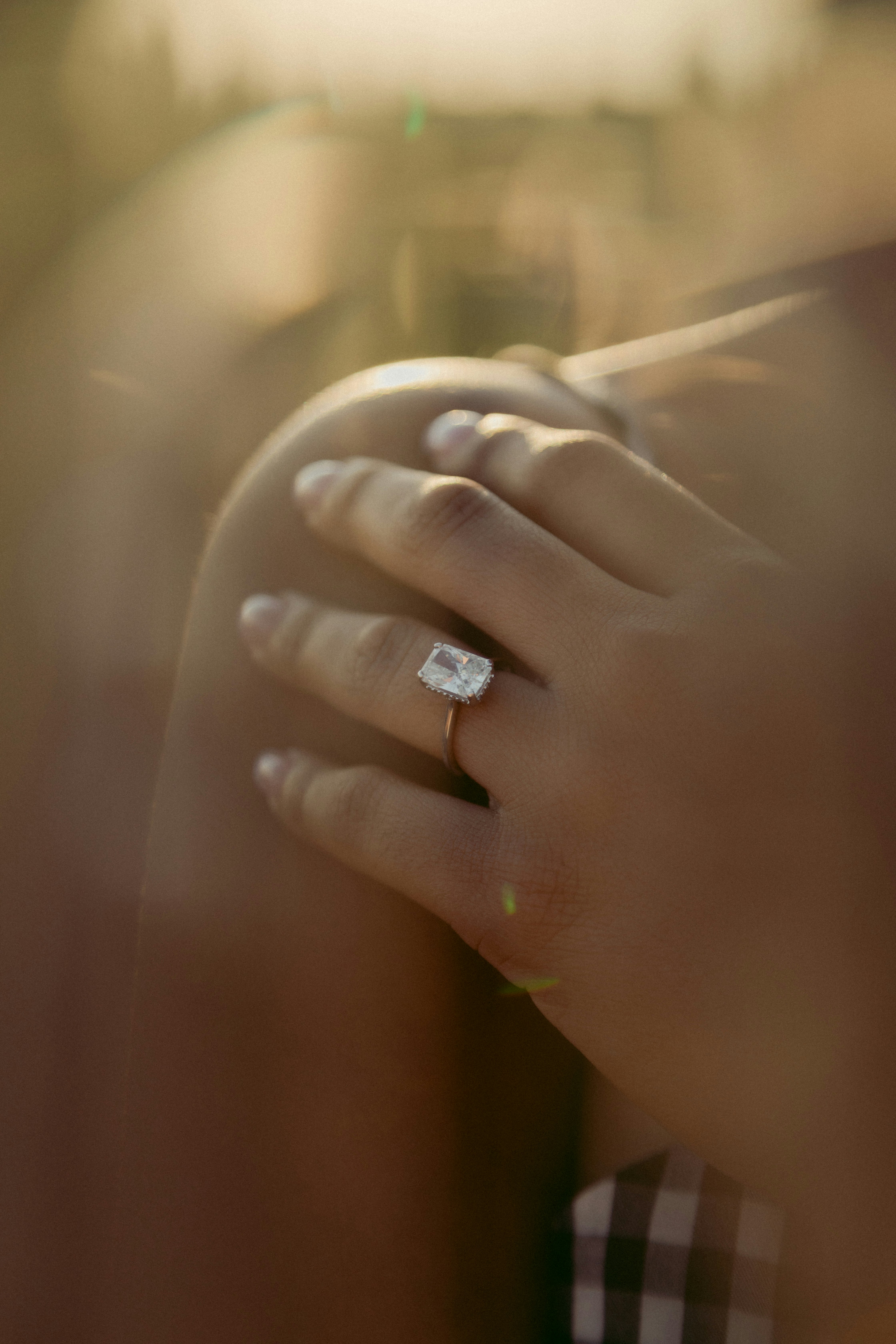 person wearing silver diamond ring